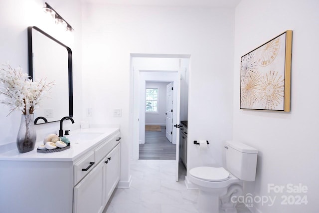 bathroom with tile patterned floors, toilet, and vanity