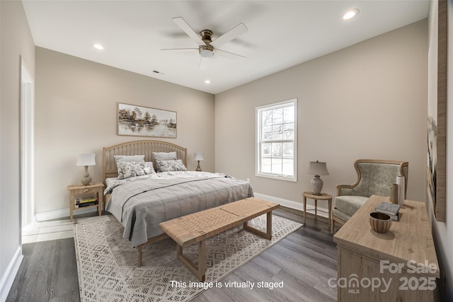 bedroom with hardwood / wood-style flooring and ceiling fan