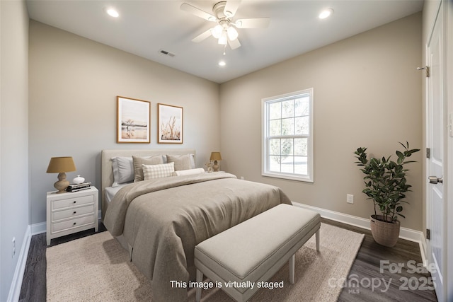 bedroom featuring dark hardwood / wood-style floors and ceiling fan