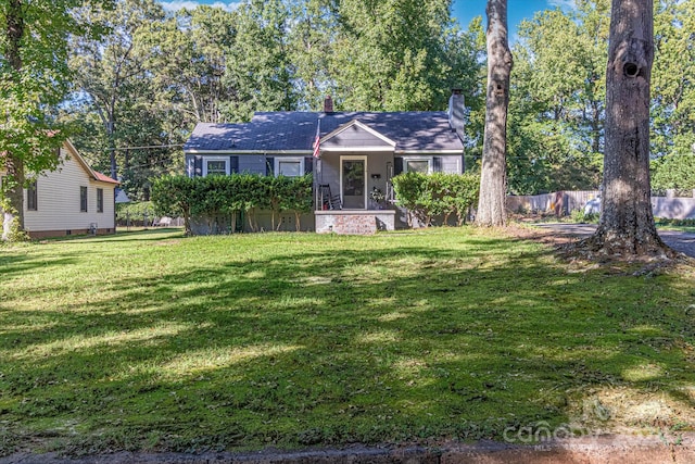 single story home with a front yard