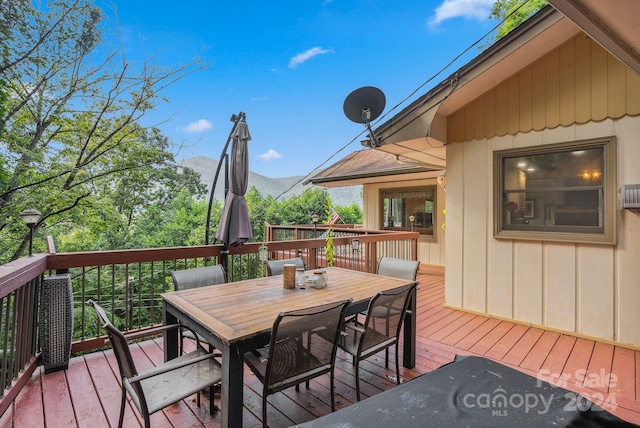 wooden terrace featuring a mountain view