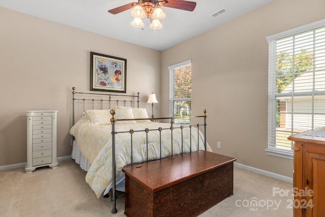 carpeted bedroom featuring ceiling fan