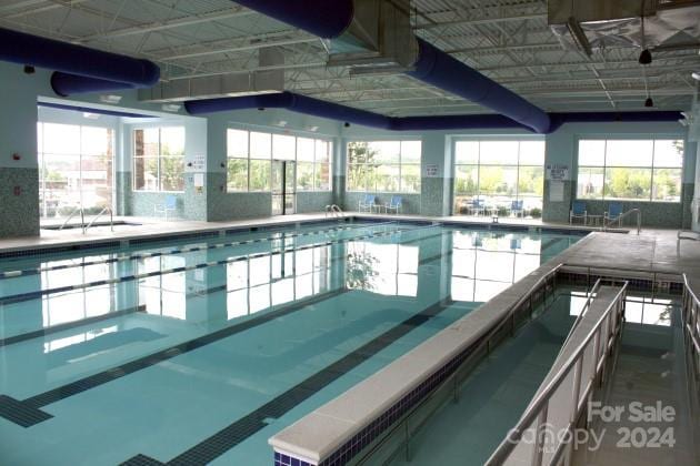 view of pool featuring a hot tub