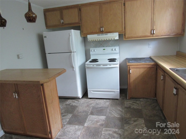 kitchen featuring crown molding, white appliances, and tasteful backsplash