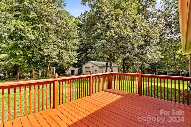 wooden terrace with a yard and a shed