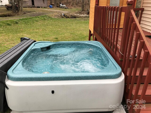 exterior space featuring a jacuzzi