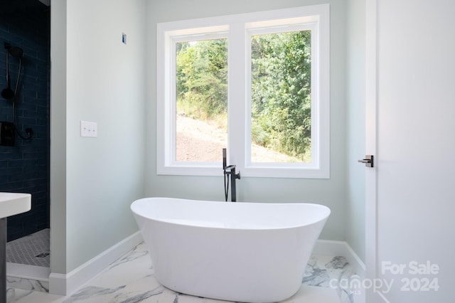 bathroom featuring separate shower and tub