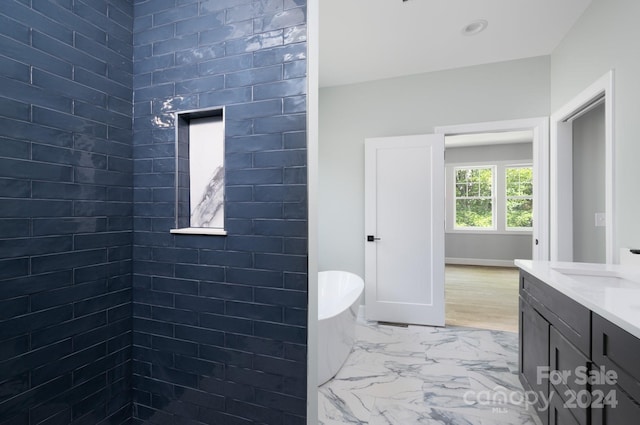 bathroom featuring vanity and shower with separate bathtub