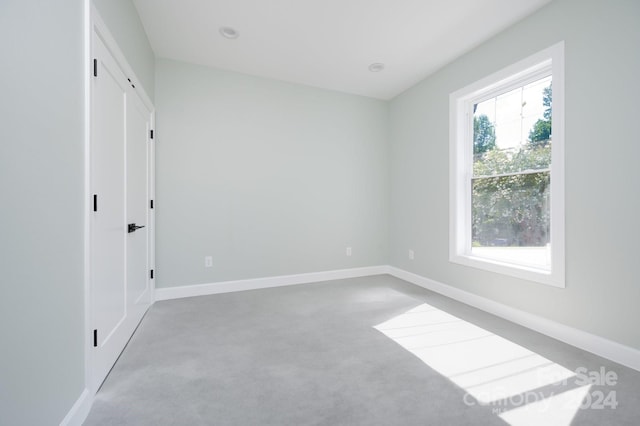 unfurnished bedroom with light carpet