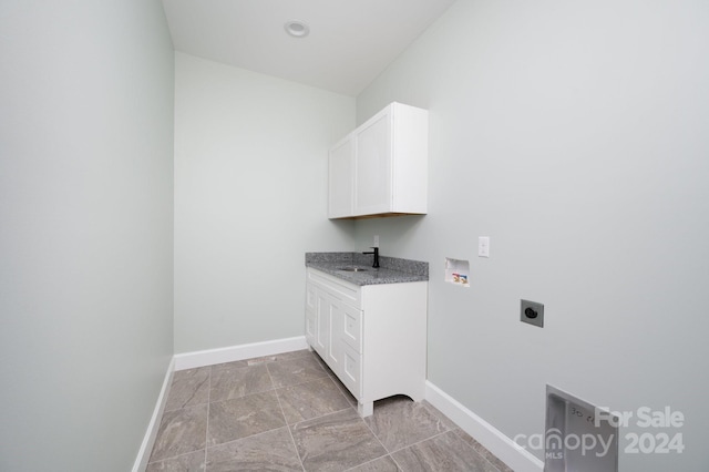 laundry area with electric dryer hookup, washer hookup, sink, and cabinets