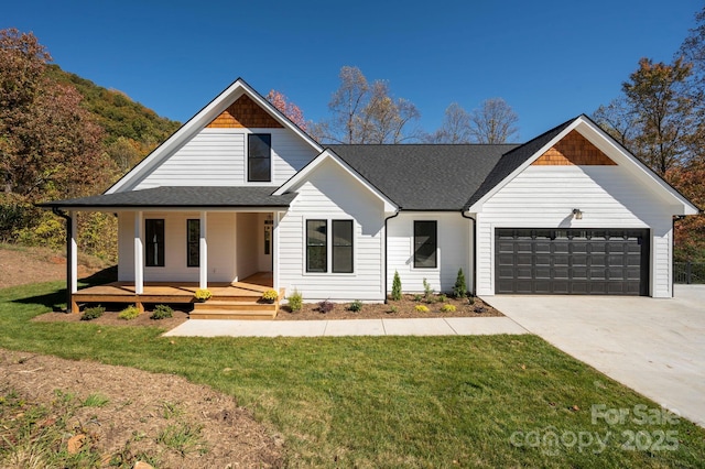 modern inspired farmhouse with a front lawn, roof with shingles, covered porch, a garage, and driveway