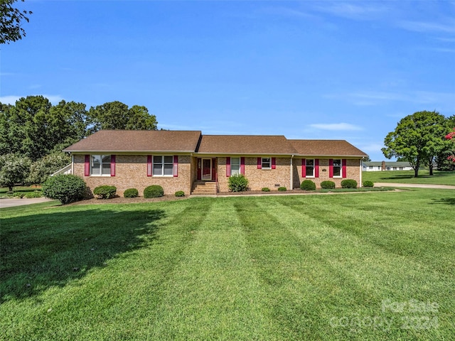 ranch-style home with a front lawn