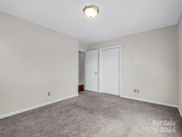 interior space with a closet and carpet floors