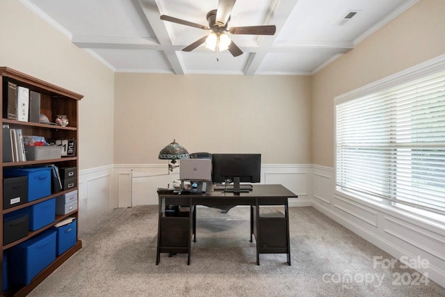 carpeted office with beamed ceiling, coffered ceiling, ceiling fan, and a wealth of natural light