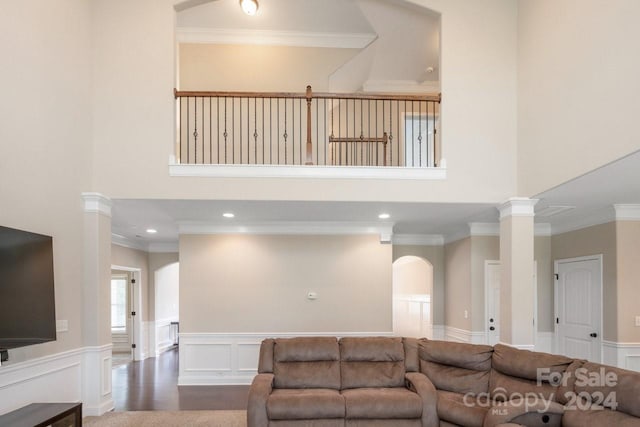 living room with ornamental molding