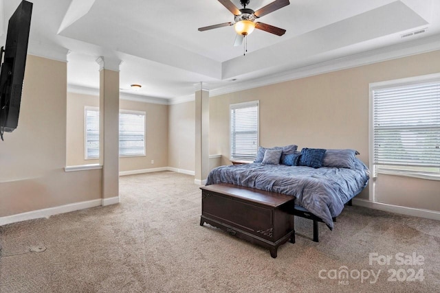 bedroom featuring light carpet, multiple windows, and ceiling fan