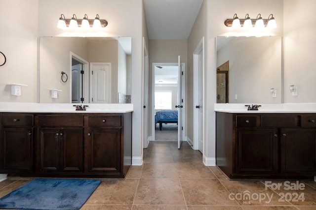 bathroom with vanity and a shower with door