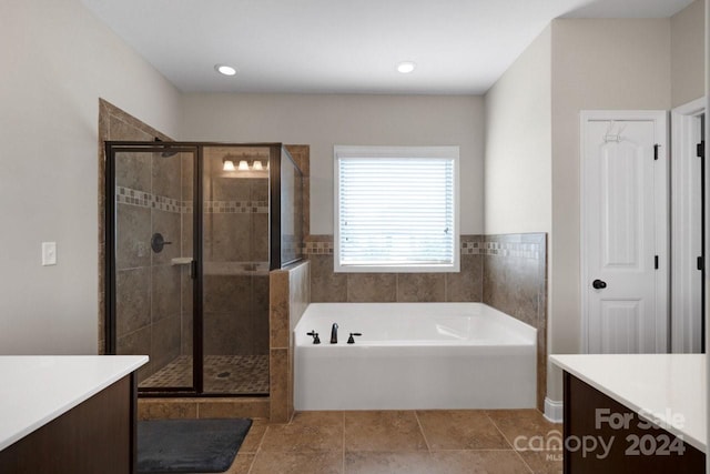 bathroom featuring independent shower and bath and vanity