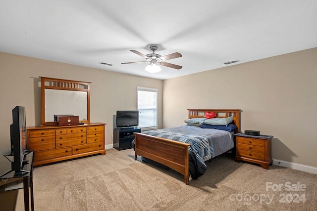 bedroom with ceiling fan and carpet floors