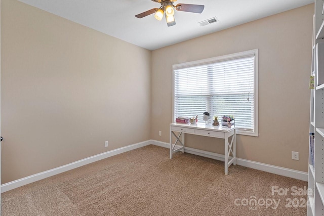 interior space with ceiling fan