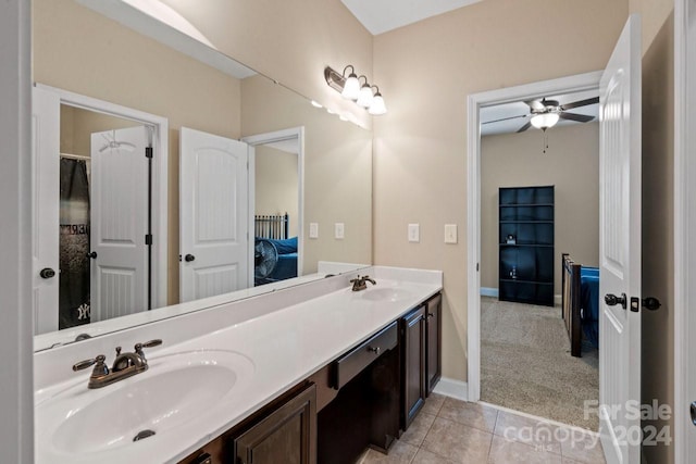 bathroom featuring tile patterned flooring, ceiling fan, and vanity