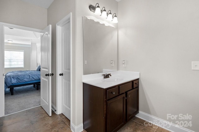 bathroom with tile patterned floors and vanity