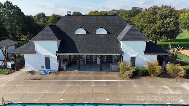 rear view of property featuring a patio area