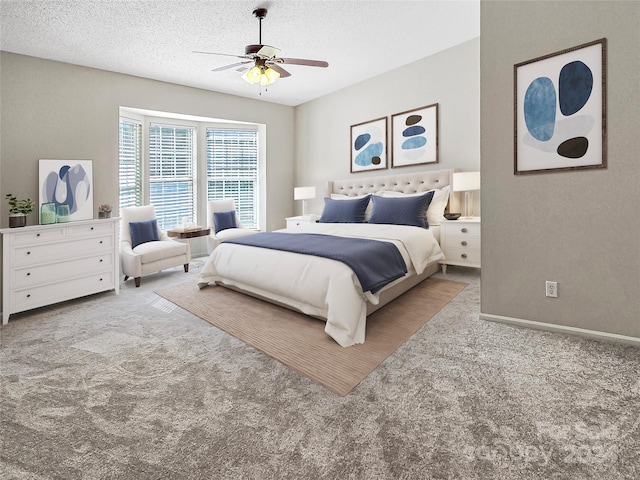 carpeted bedroom featuring ceiling fan and a textured ceiling