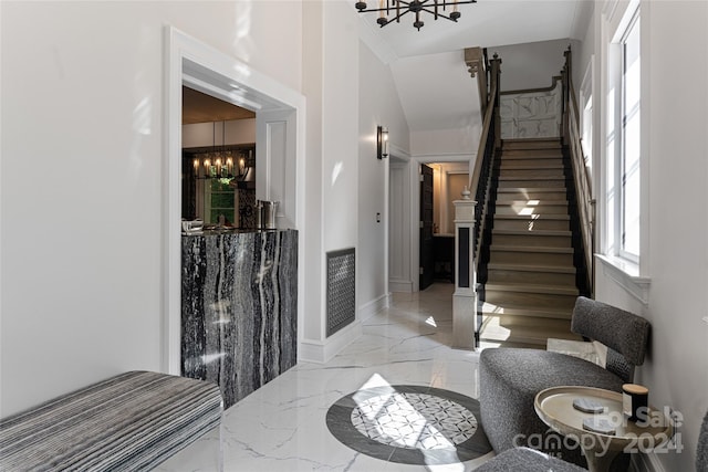 stairway with a chandelier