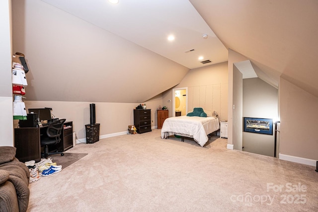 bedroom featuring vaulted ceiling and carpet