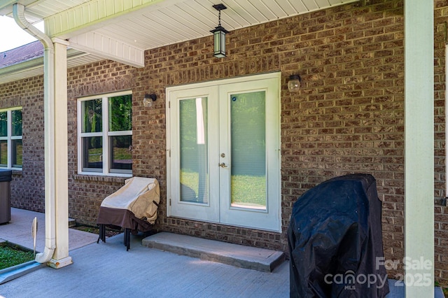 view of exterior entry featuring french doors