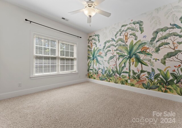 carpeted empty room with ceiling fan