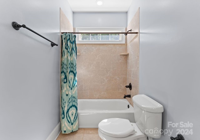 bathroom with tile patterned floors, shower / bathtub combination with curtain, and toilet