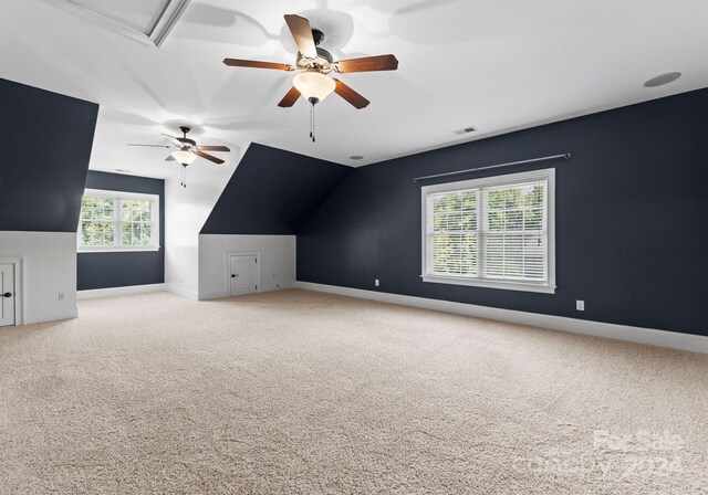 bonus room featuring carpet flooring, ceiling fan, and vaulted ceiling