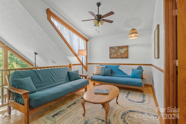 living room with plenty of natural light, ceiling fan, and hardwood / wood-style flooring