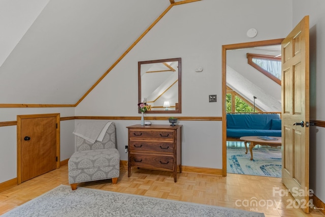 living area with vaulted ceiling and light parquet floors