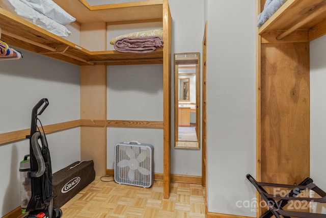 spacious closet featuring light parquet floors