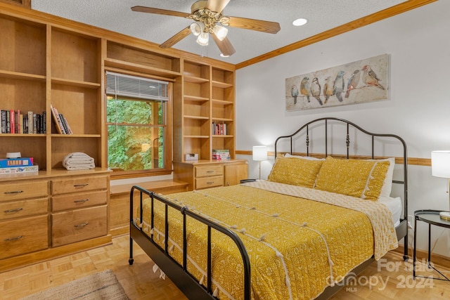 bedroom featuring ornamental molding, light parquet floors, a textured ceiling, and ceiling fan