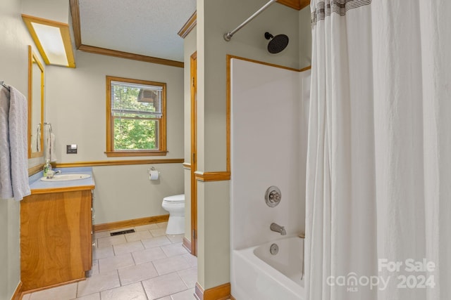 full bathroom with a textured ceiling, vanity, tile patterned flooring, toilet, and shower / bath combo with shower curtain