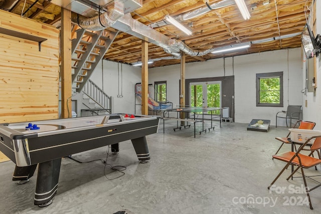 recreation room with concrete flooring