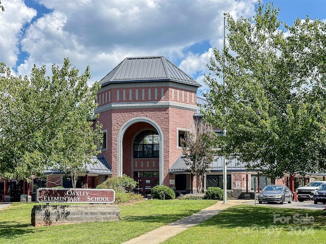 exterior space featuring a front lawn