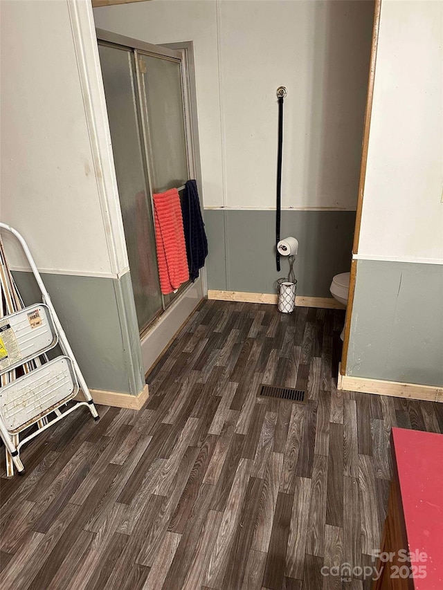 bathroom featuring toilet and hardwood / wood-style floors