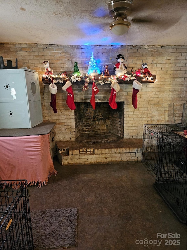 misc room featuring brick wall and a textured ceiling