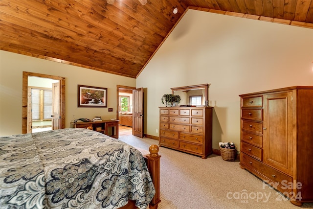 carpeted bedroom with wooden ceiling and high vaulted ceiling