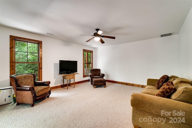 living room featuring ceiling fan and carpet floors