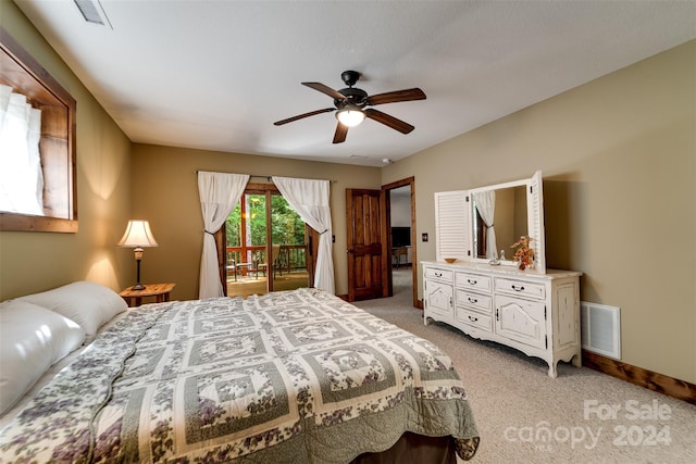 bedroom featuring ceiling fan, light carpet, and access to outside