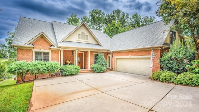 view of front of house featuring covered porch and a garage