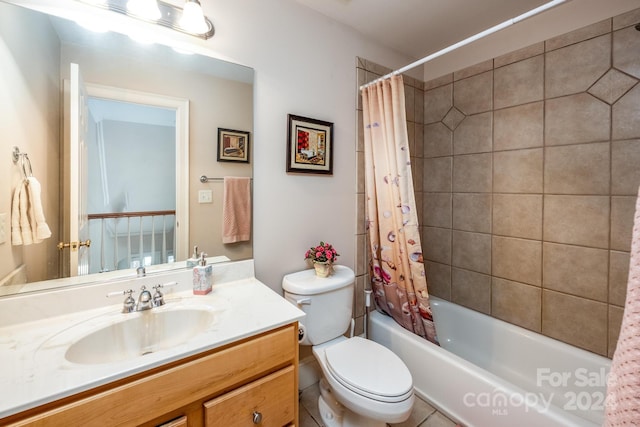 full bathroom featuring toilet, shower / tub combo with curtain, vanity, and tile patterned flooring