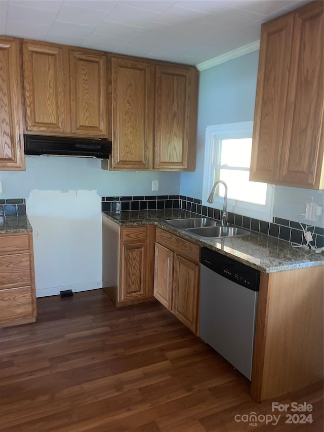 kitchen featuring range hood, crown molding, stainless steel dishwasher, sink, and dark wood-type flooring