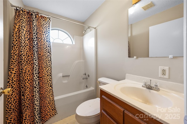 bathroom with shower / tub combo with curtain, visible vents, toilet, vanity, and a textured ceiling